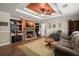 Inviting living area with stone fireplace, custom built-ins, and ample natural light at 215 Hines Dr, Bonneau, SC 29431