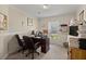 Well-lit home office featuring a dark wood desk, comfortable seating, and ample workspace for productivity at 215 Hines Dr, Bonneau, SC 29431