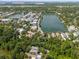 Wide aerial view of a lakeside residential area with lush greenery and blue lakes at 220 Ponsbury Rd, Mount Pleasant, SC 29464