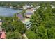 Aerial view showcasing the home's mature trees, green roof, and lush landscape at 220 Ponsbury Rd, Mount Pleasant, SC 29464