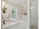 Bathroom with double sink vanity, soaking tub, and glass-enclosed shower at 220 Ponsbury Rd, Mount Pleasant, SC 29464