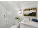 Bright bathroom features a tiled shower, a modern vanity, and unique botanical wall decor at 220 Ponsbury Rd, Mount Pleasant, SC 29464