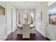 Bright dining room featuring wood table, upholstered chairs, and large windows with natural light at 220 Ponsbury Rd, Mount Pleasant, SC 29464