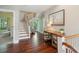 Foyer with hardwood floors, staircase, console table, and decorative artwork at 220 Ponsbury Rd, Mount Pleasant, SC 29464