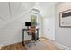 Cozy home office with a wooden desk, adjustable chair, and a sunlit window at 220 Ponsbury Rd, Mount Pleasant, SC 29464
