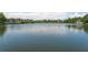 Scenic lake view showcasing waterfront homes and lush greenery in a serene setting at 220 Ponsbury Rd, Mount Pleasant, SC 29464