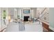Elegant living room featuring a fireplace, comfortable seating, and seamless flow to other areas at 220 Ponsbury Rd, Mount Pleasant, SC 29464