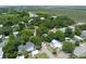 Stunning aerial view showcasing the neighborhood, lush greenery, and waterfront views in the area at 2218 Myrtle Ave, Sullivans Island, SC 29482