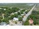Beautiful aerial view of the neighborhood showcasing its tree-lined streets, houses, and natural beauty at 2218 Myrtle Ave, Sullivans Island, SC 29482
