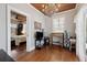 Comfortable bedroom with an adjacent room, featuring wood floors and a beaded chandelier at 2218 Myrtle Ave, Sullivans Island, SC 29482