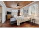 Bedroom featuring wood floors, a fan, and windows that provide plenty of natural light at 2218 Myrtle Ave, Sullivans Island, SC 29482