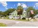 Charming raised beach home with lush landscaping, and a white picket fence at 2218 Myrtle Ave, Sullivans Island, SC 29482