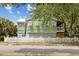 Charming home with a well-manicured lawn, picket fence, and inviting curb appeal at 2218 Myrtle Ave, Sullivans Island, SC 29482