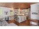Well-appointed kitchen with an island, granite countertops, stainless steel appliances, and barstool seating at 2218 Myrtle Ave, Sullivans Island, SC 29482