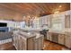 Kitchen view showcasing granite countertops, stainless steel appliances, and a wooden-beaded chandelier at 2218 Myrtle Ave, Sullivans Island, SC 29482