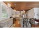 Stylish kitchen with granite countertops, stainless steel appliances, and elegant pendant lighting at 2218 Myrtle Ave, Sullivans Island, SC 29482