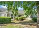 Well-maintained backyard featuring lush greenery, trimmed hedges, and a peaceful outdoor space at 2438 Hansard Dr, North Charleston, SC 29406