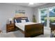 Bright bedroom features a comfortable queen bed, soft natural light, and a serene ambiance at 2438 Hansard Dr, North Charleston, SC 29406