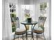 Cozy breakfast nook surrounded by large windows that let in plenty of natural light at 2438 Hansard Dr, North Charleston, SC 29406