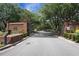 Gated community entrance with brick columns and lush landscaping, creating a secure and welcoming atmosphere at 2438 Hansard Dr, North Charleston, SC 29406