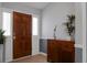 Inviting entryway featuring a hardwood floor, stylish decor, and a solid wooden front door at 2438 Hansard Dr, North Charleston, SC 29406