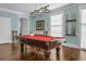 Bright game room featuring a pool table and natural light, perfect for entertaining guests and residents at 2438 Hansard Dr, North Charleston, SC 29406