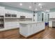 Spacious modern kitchen with white cabinetry, stainless steel appliances, and a large center island, perfect for cooking at 2438 Hansard Dr, North Charleston, SC 29406