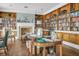 Cozy library with extensive built-in bookshelves, a fireplace, and comfortable seating, ideal for reading at 2438 Hansard Dr, North Charleston, SC 29406