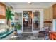 Bright, airy sunroom with seating, large glass doors, and connection to the rest of the home at 2438 Hansard Dr, North Charleston, SC 29406
