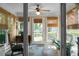 Inviting sunroom with natural light, slate floors and comfortable seating, perfect for relaxation at 2438 Hansard Dr, North Charleston, SC 29406