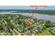 An aerial view showcases the home's location within a neighborhood, highlighting the proximity to waterways and lush landscaping at 2800 River Vista Way, Mount Pleasant, SC 29466