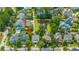 An aerial shot of the home, showcasing its location within a neighborhood with lush greenery and a serene pond at 2800 River Vista Way, Mount Pleasant, SC 29466