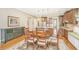 Bright dining area features wood floors, access to the kitchen, and a view of the living room at 2800 River Vista Way, Mount Pleasant, SC 29466