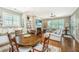 Cozy dining area is adjacent to the living room, featuring a wood table, comfortable seating, and natural light at 2800 River Vista Way, Mount Pleasant, SC 29466