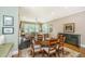 Charming dining area with wood table, comfortable seating, and seamless access to the living area at 2800 River Vista Way, Mount Pleasant, SC 29466