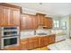 Kitchen showcasing custom cabinetry, stainless steel appliances and a cozy window bench at 2800 River Vista Way, Mount Pleasant, SC 29466