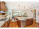 Bright kitchen featuring a large island with granite countertops and stainless steel appliances at 2800 River Vista Way, Mount Pleasant, SC 29466