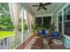 Inviting screened porch featuring comfortable seating, ceiling fan, and exterior views at 2800 River Vista Way, Mount Pleasant, SC 29466