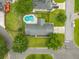 An overhead aerial view showcasing the home's backyard pool, landscaping, and surrounding neighborhood at 2942 Foxhall Rd, Charleston, SC 29414