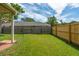 Spacious backyard featuring a lawn, wood fences, and view of neighboring houses at 2942 Foxhall Rd, Charleston, SC 29414