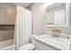 Well-lit bathroom featuring a sink with granite countertops, a toilet, and shower with white curtain at 2942 Foxhall Rd, Charleston, SC 29414