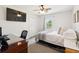 Cozy bedroom with a ceiling fan, closet, window, and television at 2942 Foxhall Rd, Charleston, SC 29414