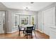 Cozy dining area with a bay window, hardwood floors, and a view of the backyard at 2942 Foxhall Rd, Charleston, SC 29414