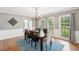 Traditional dining room featuring a chandelier, area rug and natural light from the double windows at 2942 Foxhall Rd, Charleston, SC 29414