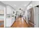 Bright, all-white kitchen with stainless steel appliances and ample counter space at 2942 Foxhall Rd, Charleston, SC 29414