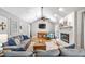 Spacious living room featuring a brick fireplace, hardwood flooring, and comfortable seating at 2942 Foxhall Rd, Charleston, SC 29414