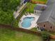 Aerial view showcasing the home's backyard pool area with ample patio space and lounge chairs at 2942 Foxhall Rd, Charleston, SC 29414