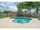 Backyard pool with brick home exterior, well-maintained lawn, and partial view of neighborhood at 2942 Foxhall Rd, Charleston, SC 29414