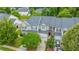 An aerial view of a well-maintained home, lush landscaping, and convenient two-car garage at 3012 Candela Grove Dr, Charleston, SC 29414