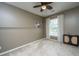 Neutral bedroom features a ceiling fan, a window with blinds, and a shelf with decor at 3012 Candela Grove Dr, Charleston, SC 29414